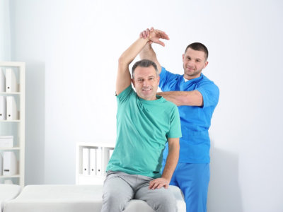 therapist doing therapy to a patient
